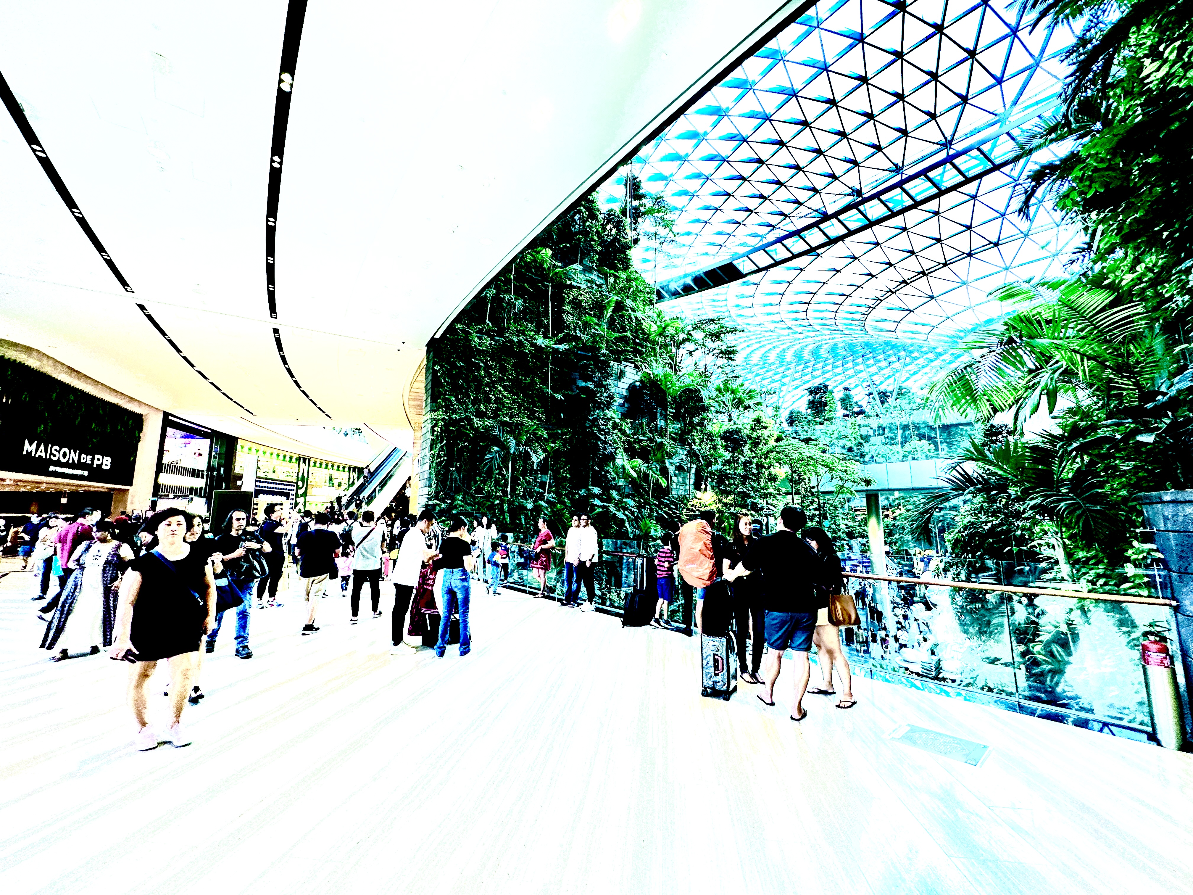 Stunning Jewel Airport architecture featuring a mesmerizing indoor waterfall, bustling shopping areas, and lively shoppers enjoying the unique retail experience