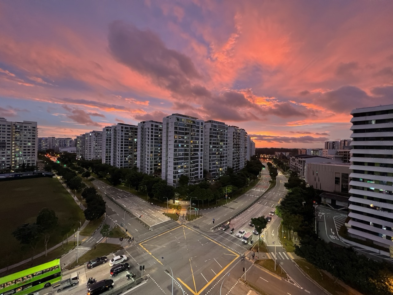 Spectacular sunset over Punggol Central with condominium buildings and road.