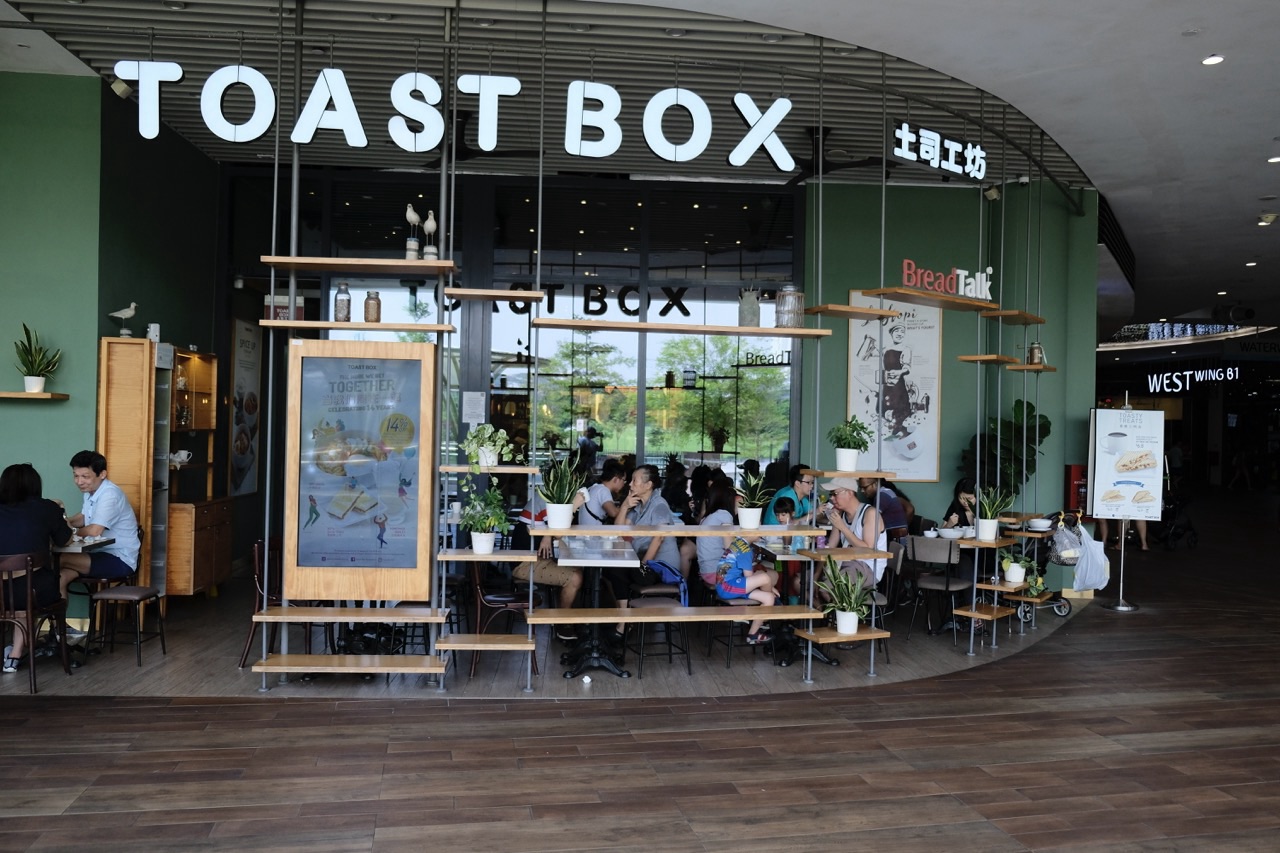 People eating and socialising at Toast Box inside Waterway Point.
