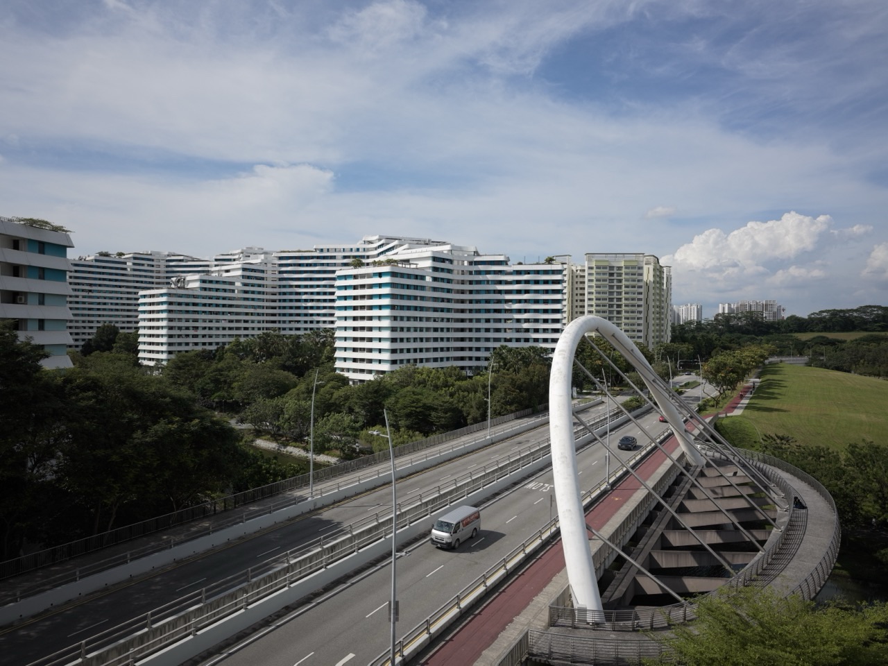 HDB flats and road beside a bridge over the Punggol Waterway