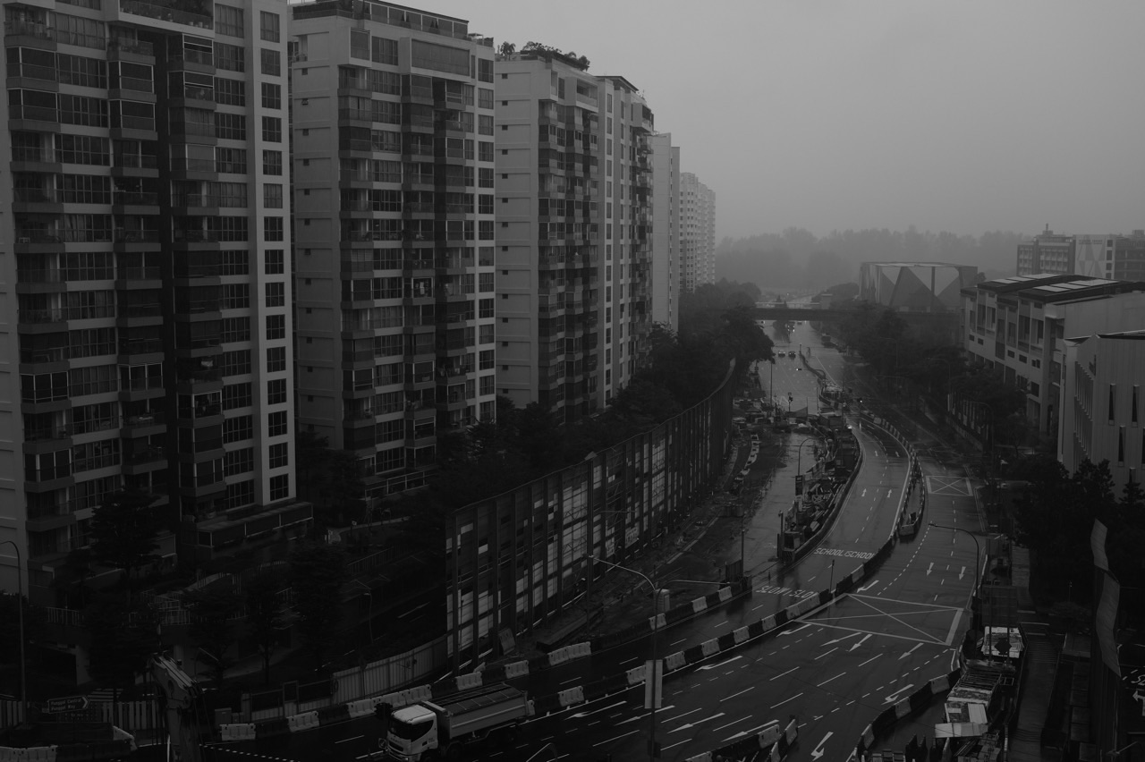 Punggol condominium and wet road during rain
