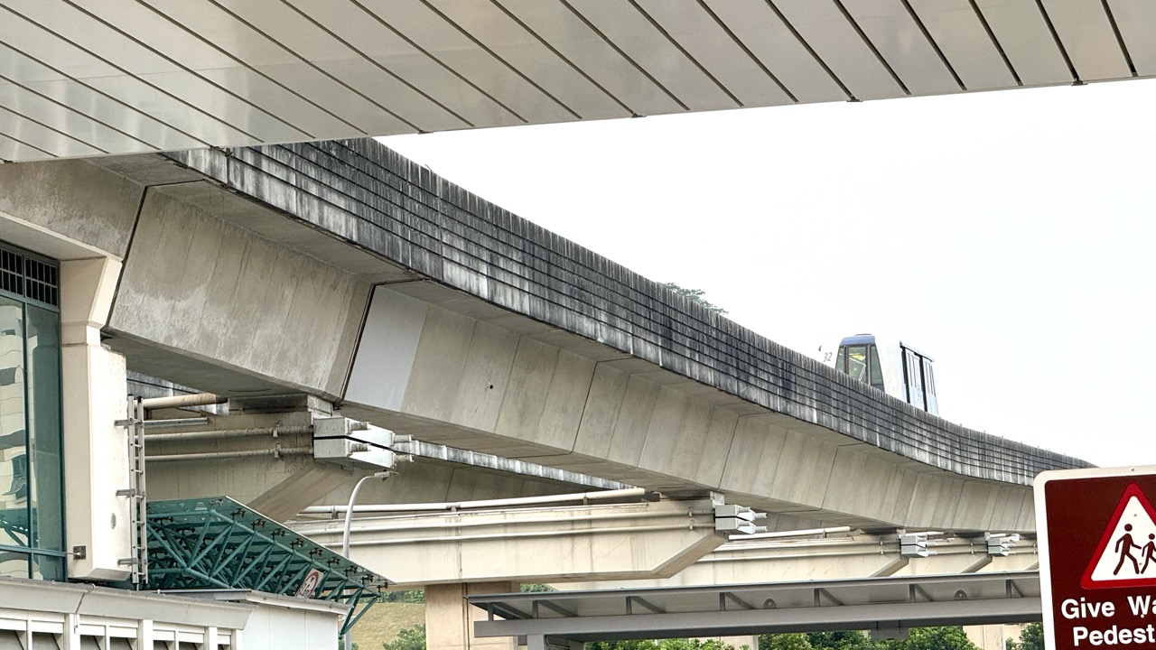 LRT train travelling on elevated tracks near Sam Kee LRT station in Punggol.