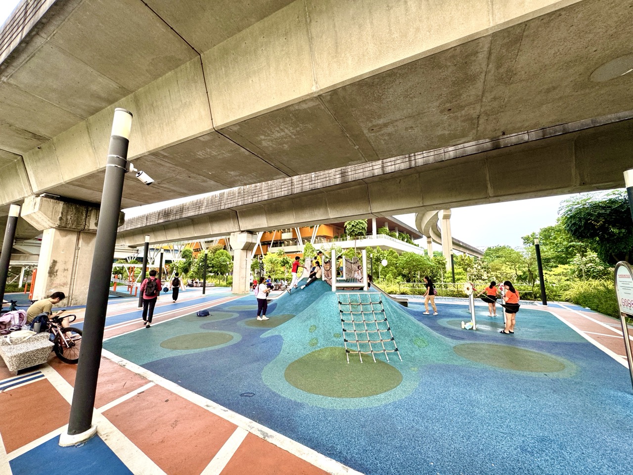 Children's playground situated underneath elevated LRT tracks in Punggol.
